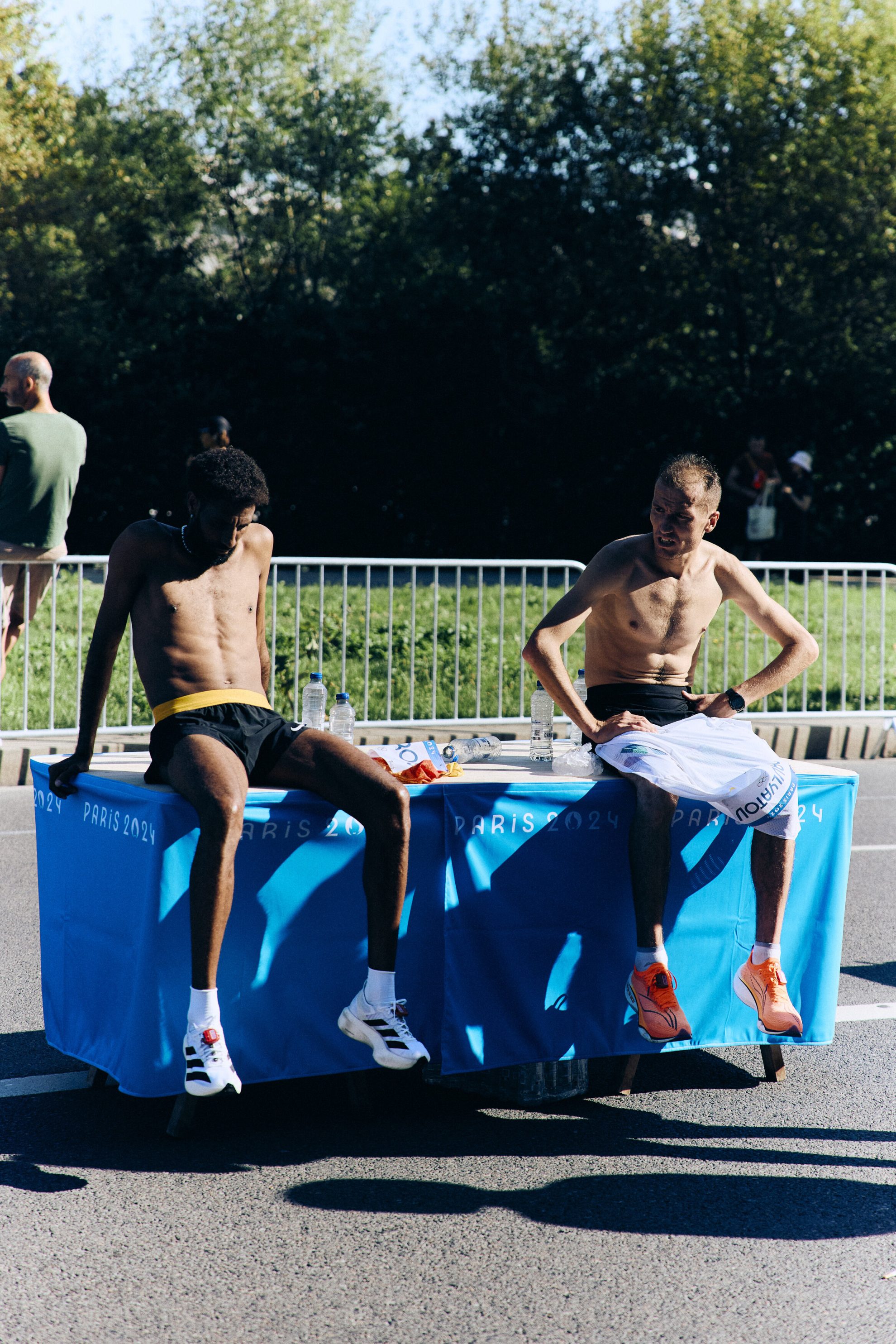 2 athletes sitting on table